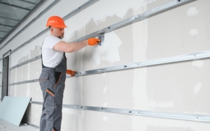 worker repainting wall
