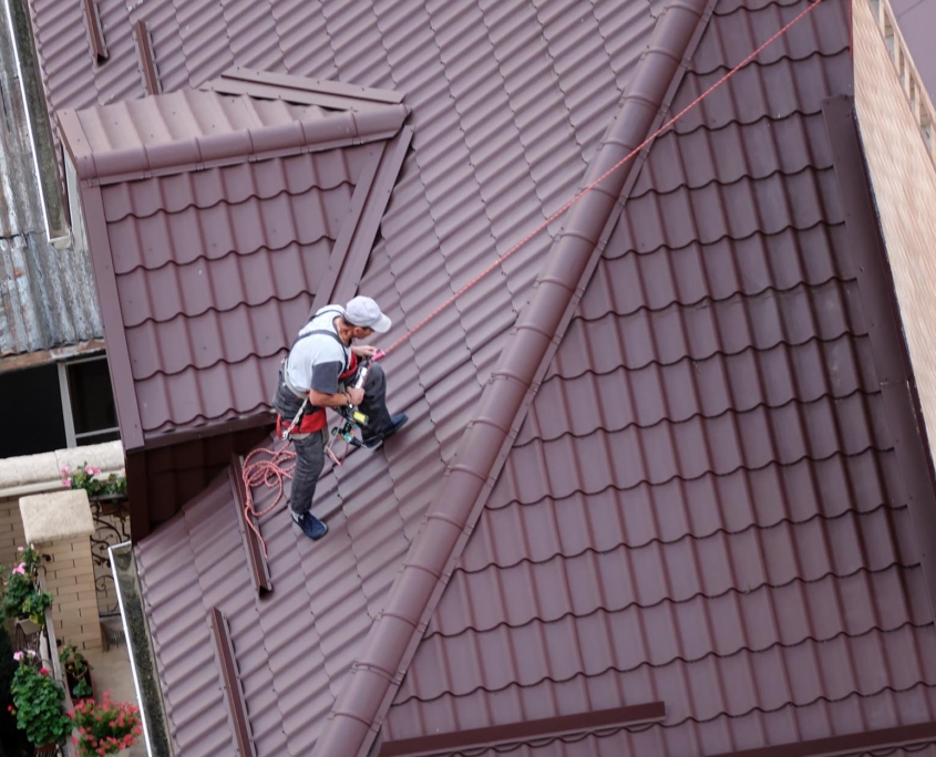 Person climbing roof