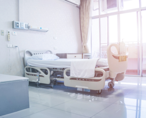 Side view of hospital bed in clean clean healthcare facility